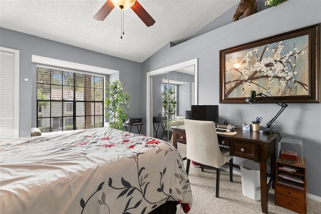 5100 Burchette Rd Unit 2702, Tampa, FL 33647 - bedroom featuring carpet, vaulted ceiling, a closet, a textured ceiling, and ceiling fan