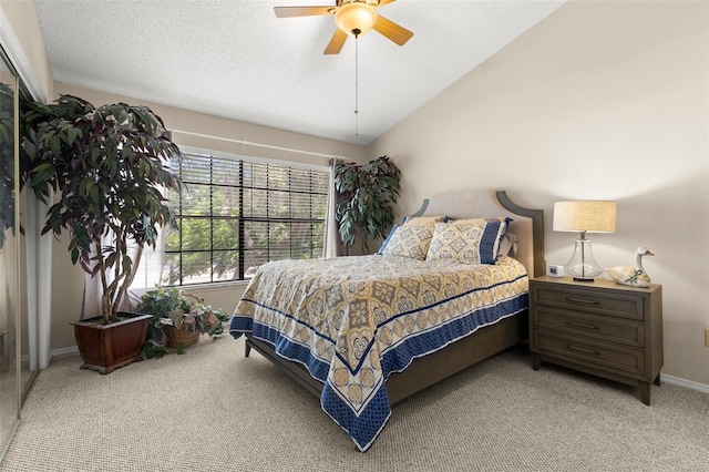 5100 Burchette Rd Unit 2702, Tampa, FL 33647 - bedroom with carpet, baseboards, lofted ceiling, ceiling fan, and a textured ceiling