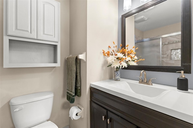 5100 Burchette Rd Unit 2702, Tampa, FL 33647 - bathroom featuring toilet, vanity, and a shower with shower door