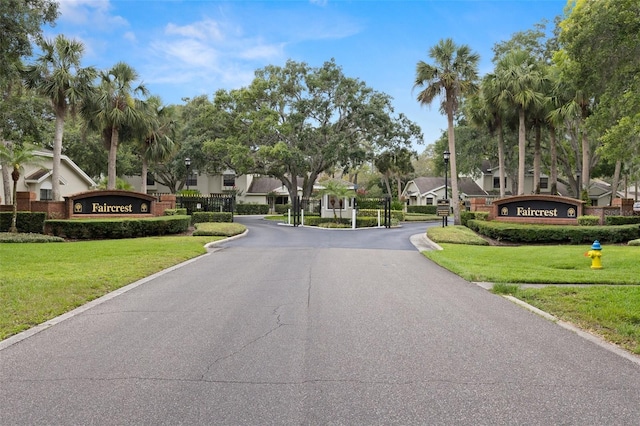 5100 Burchette Rd Unit 2702, Tampa, FL 33647 - view of asphalt street featuring a residential view, street lighting, and a gated entry