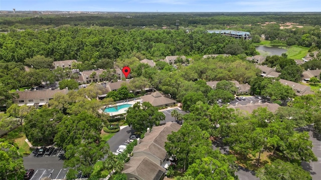 5100 Burchette Rd Unit 2702, Tampa, FL 33647 - aerial overview of property's location with a heavily wooded area, a nearby body of water, and a pool area