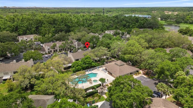 5100 Burchette Rd Unit 2702, Tampa, FL 33647 - bird's eye view of a forest, a pool area, and a nearby body of water