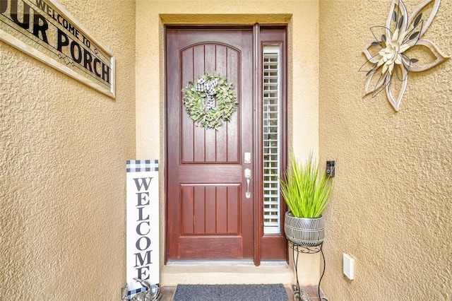 222 Toscavilla Blvd, Nokomis, FL 34275 - doorway to property featuring stucco siding