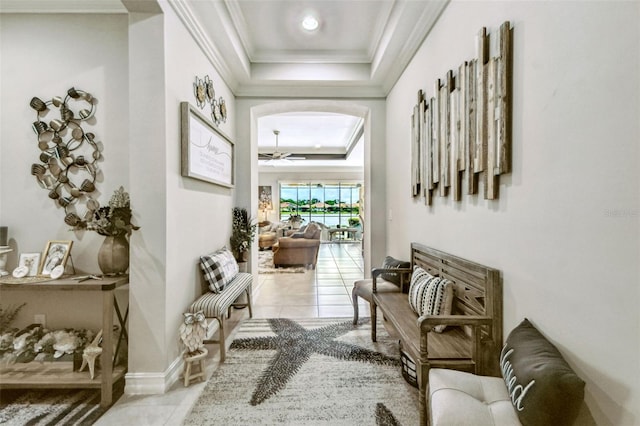 222 Toscavilla Blvd, Nokomis, FL 34275 - hallway with a tray ceiling, arched walkways, crown molding, and tile patterned floors