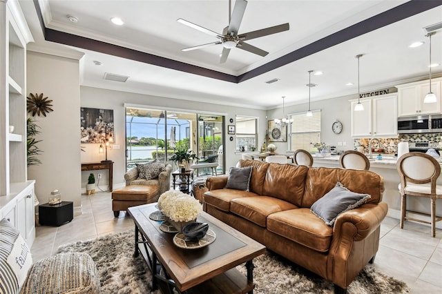 222 Toscavilla Blvd, Nokomis, FL 34275 - living room featuring ceiling fan, light tile patterned flooring, plenty of natural light, crown molding, and recessed lighting
