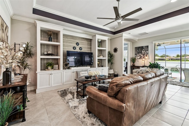 222 Toscavilla Blvd, Nokomis, FL 34275 - living room with a ceiling fan, crown molding, light tile patterned floors, built in features, and a tray ceiling