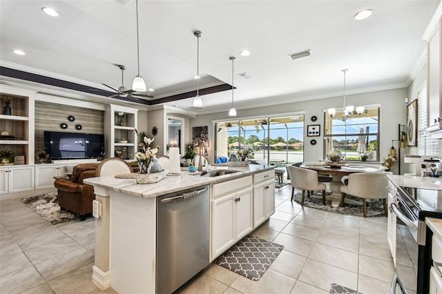 222 Toscavilla Blvd, Nokomis, FL 34275 - kitchen with appliances with stainless steel finishes, crown molding, light tile patterned floors, light stone countertops, and decorative light fixtures