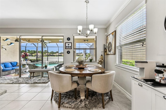 222 Toscavilla Blvd, Nokomis, FL 34275 - dining space with light tile patterned floors, healthy amount of natural light, a chandelier, crown molding, and a sunroom
