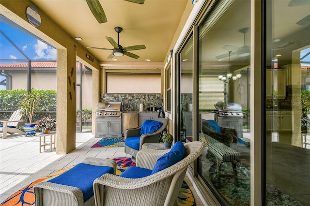 222 Toscavilla Blvd, Nokomis, FL 34275 - view of patio featuring ceiling fan, exterior kitchen, and glass enclosure