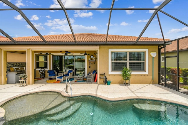 222 Toscavilla Blvd, Nokomis, FL 34275 - outdoor pool with an outdoor kitchen, glass enclosure, a patio area, and ceiling fan