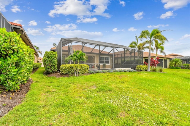 222 Toscavilla Blvd, Nokomis, FL 34275 - rear view of property with a yard