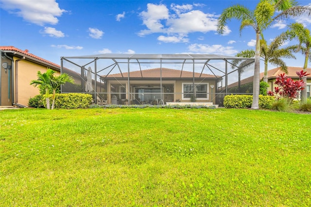 222 Toscavilla Blvd, Nokomis, FL 34275 - rear view of house featuring a yard