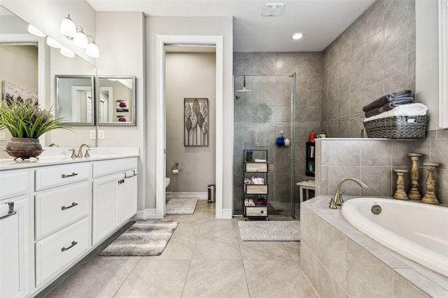 222 Toscavilla Blvd, Nokomis, FL 34275 - bathroom with vanity, a bath, a stall shower, and tile patterned floors