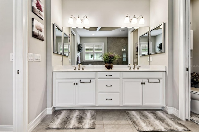 222 Toscavilla Blvd, Nokomis, FL 34275 - bathroom featuring double vanity, tile patterned flooring, and a shower