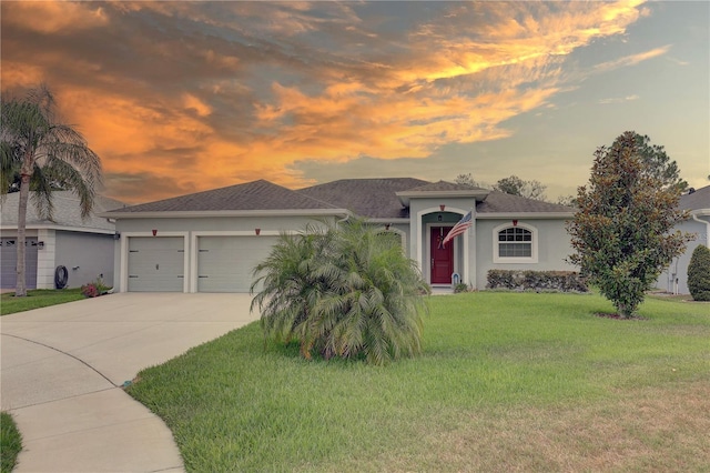 3813 Salida Delsol Dr, Sun City Center, FL 33573 - ranch-style home featuring concrete driveway, a garage, stucco siding, a front yard, and a shingled roof