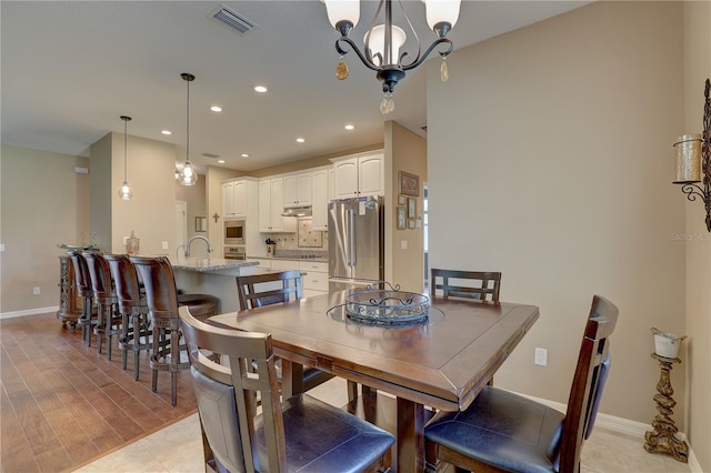3813 Salida Delsol Dr, Sun City Center, FL 33573 - dining area featuring recessed lighting, a chandelier, and baseboards
