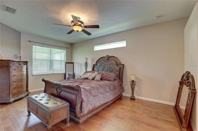 3813 Salida Delsol Dr, Sun City Center, FL 33573 - bedroom featuring light wood-style floors, ceiling fan, and baseboards