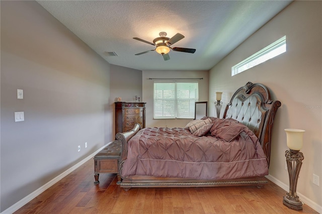 3813 Salida Delsol Dr, Sun City Center, FL 33573 - bedroom featuring wood finished floors, baseboards, and a ceiling fan