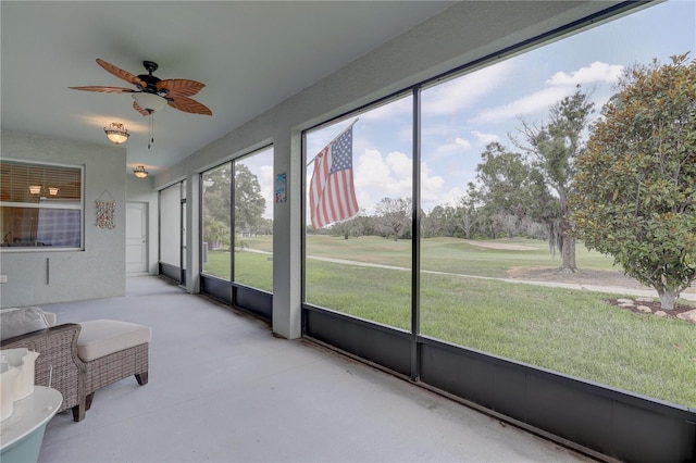 3813 Salida Delsol Dr, Sun City Center, FL 33573 - sunroom featuring ceiling fan and golf course view