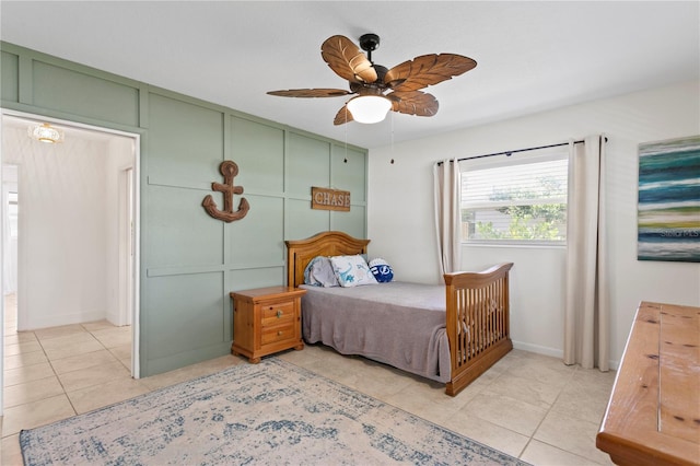 125 Live Oak Ln, Largo, FL 33770 - bedroom with light tile patterned floors, a ceiling fan, and baseboards