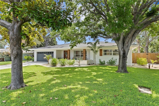 125 Live Oak Ln, Largo, FL 33770 - ranch-style house with driveway, a garage, and stucco siding