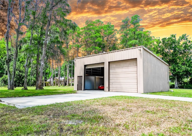 1025 Reading Rd, Lutz, FL 33558 - garage at dusk with a lawn and a garage