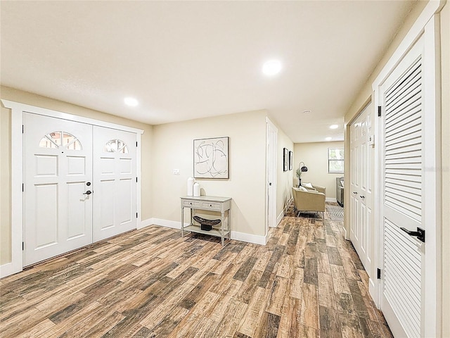 1025 Reading Rd, Lutz, FL 33558 - foyer with wood finished floors, recessed lighting, and baseboards