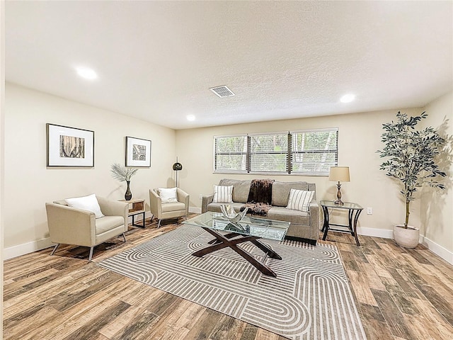 1025 Reading Rd, Lutz, FL 33558 - living area with wood finished floors, recessed lighting, and baseboards