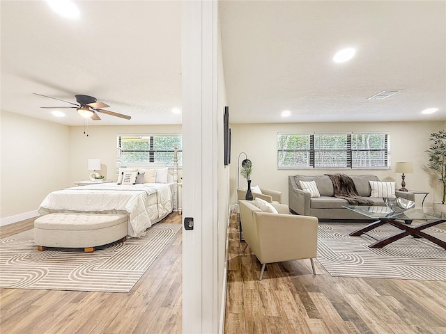 1025 Reading Rd, Lutz, FL 33558 - bedroom with wood finished floors, recessed lighting, baseboards, and ceiling fan