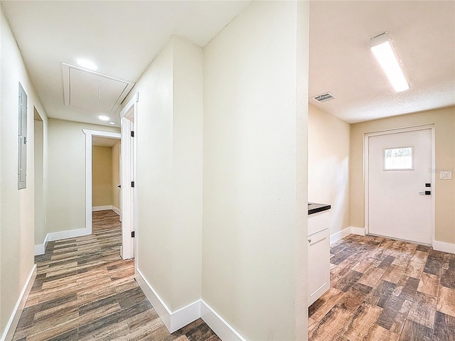 1025 Reading Rd, Lutz, FL 33558 - corridor with attic access, wood finished floors, baseboards, electric panel, and recessed lighting