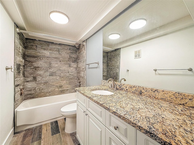 1025 Reading Rd, Lutz, FL 33558 - full bath featuring wood finished floors, toilet, vanity, and  shower combination