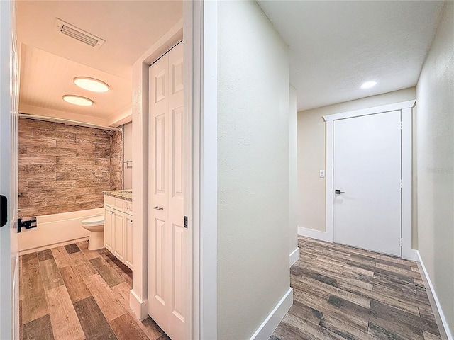 1025 Reading Rd, Lutz, FL 33558 - hallway with light wood-style floors, baseboards, and recessed lighting