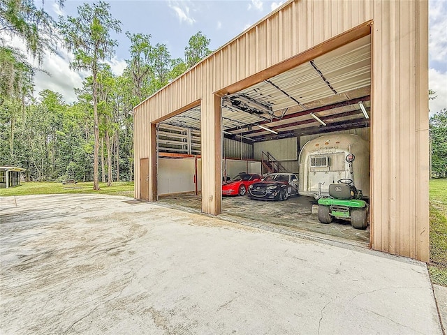 1025 Reading Rd, Lutz, FL 33558 - view of parking with an outbuilding