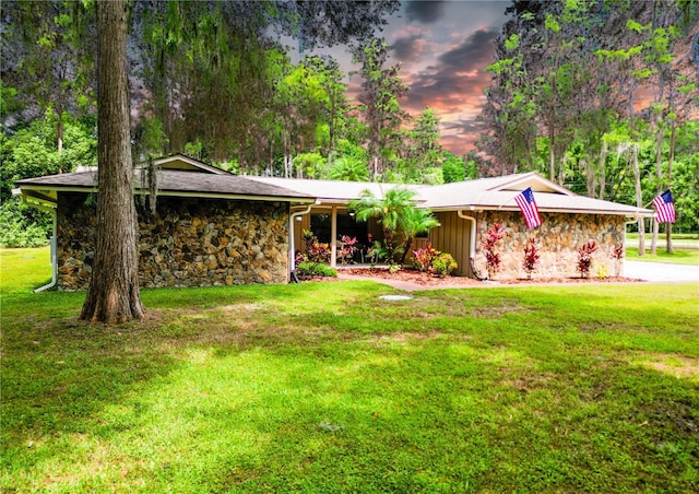1025 Reading Rd, Lutz, FL 33558 - view of front of home featuring stone siding and a front yard