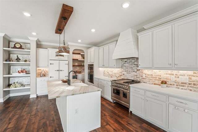 19191 Pease Pl, Lutz, FL 33558 - kitchen featuring a sink, open shelves, stainless steel appliances, custom range hood, and ornamental molding