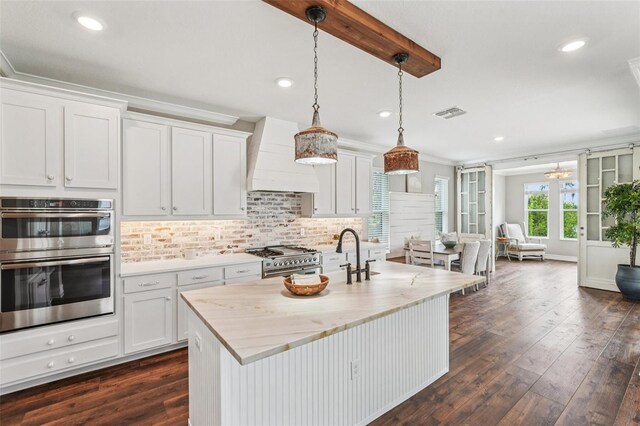 19191 Pease Pl, Lutz, FL 33558 - kitchen with stainless steel appliances, custom exhaust hood, recessed lighting, backsplash, and dark wood finished floors