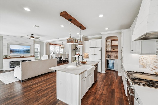 19191 Pease Pl, Lutz, FL 33558 - kitchen with custom exhaust hood, beverage cooler, ornamental molding, a sink, and ceiling fan