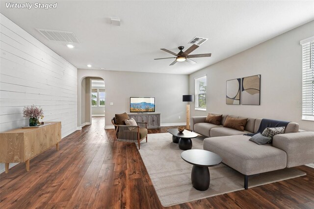 19191 Pease Pl, Lutz, FL 33558 - living area featuring arched walkways, wood finished floors, recessed lighting, ceiling fan, and baseboards