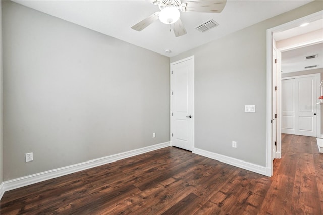 19191 Pease Pl, Lutz, FL 33558 - unfurnished bedroom featuring dark wood finished floors, baseboards, and ceiling fan