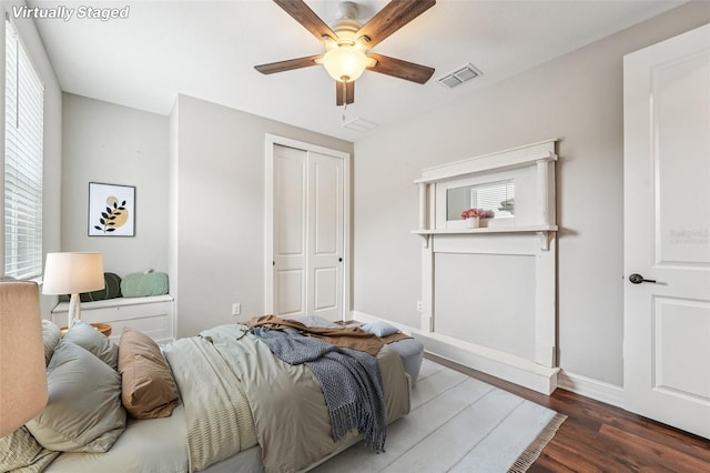 19191 Pease Pl, Lutz, FL 33558 - bedroom with wood finished floors, baseboards, a closet, and ceiling fan