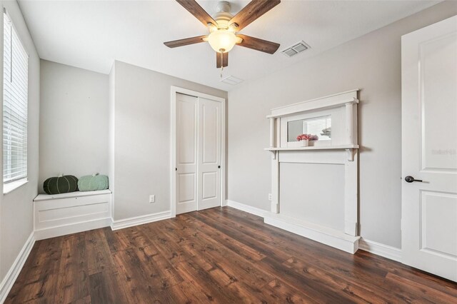 19191 Pease Pl, Lutz, FL 33558 - unfurnished bedroom featuring multiple windows and wood finished floors