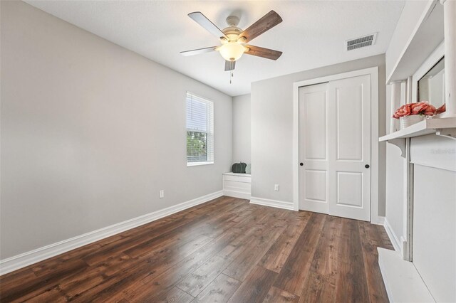 19191 Pease Pl, Lutz, FL 33558 - unfurnished bedroom with hardwood / wood-style floors, baseboards, a closet, and a ceiling fan
