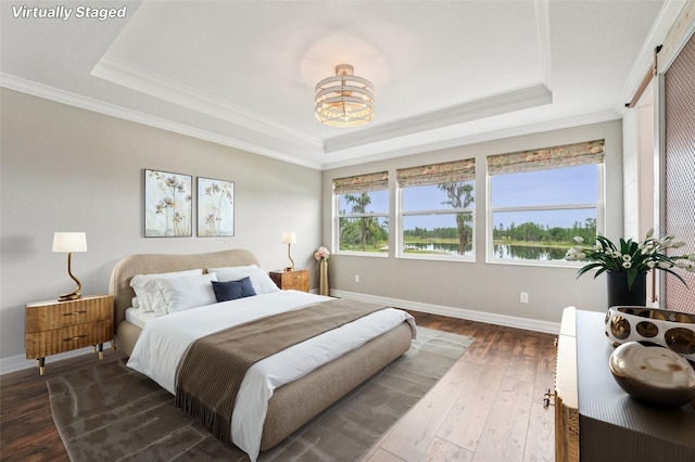 19191 Pease Pl, Lutz, FL 33558 - bedroom with a raised ceiling, crown molding, hardwood / wood-style floors, baseboards, and a chandelier