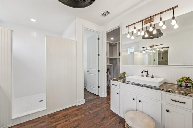 19191 Pease Pl, Lutz, FL 33558 - full bathroom featuring walk in shower, wood finished floors, vanity, and a chandelier