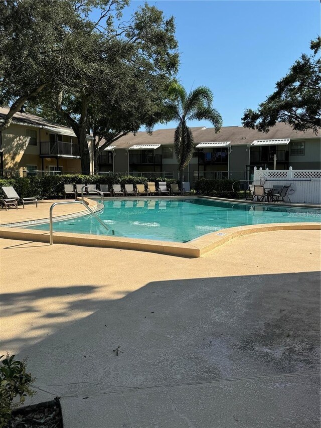 3802 N Oak Dr Unit W22, Tampa, FL 33611 - community pool with a patio area