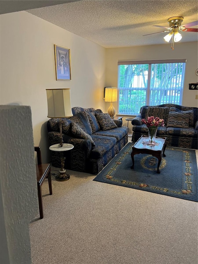 7616 Colonial Ct, Tampa, FL 33615 - living room with a textured ceiling, ceiling fan, and carpet floors