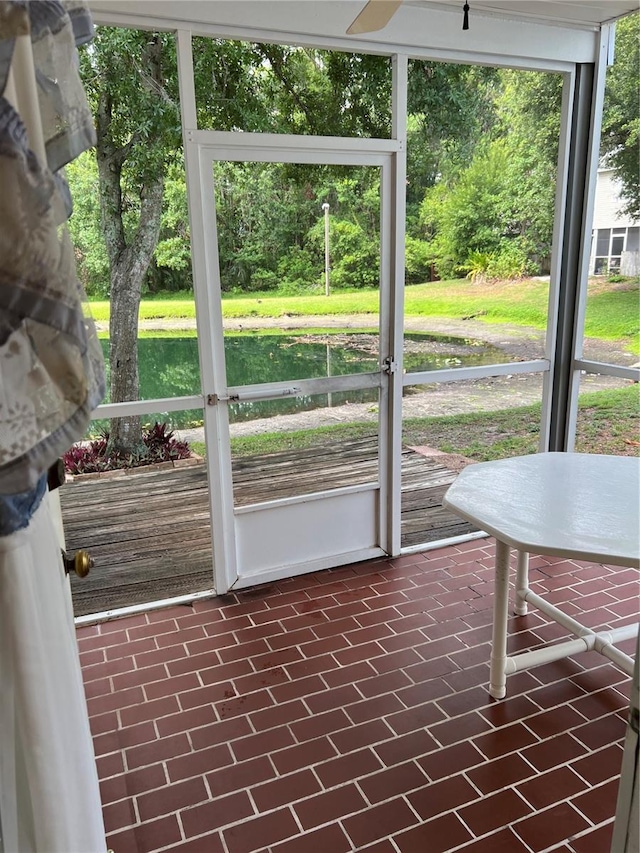 7616 Colonial Ct, Tampa, FL 33615 - unfurnished sunroom featuring a water view