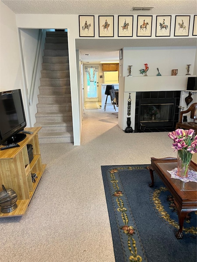 7616 Colonial Ct, Tampa, FL 33615 - living room with carpet, stairs, and a fireplace
