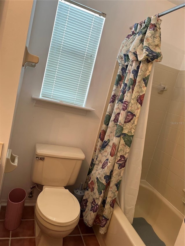 7616 Colonial Ct, Tampa, FL 33615 - full bathroom featuring shower / bath combination with curtain, tile patterned flooring, and toilet