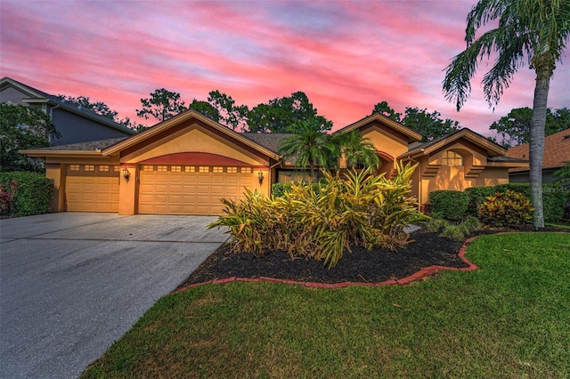 4133 Auston Way, Palm Harbor, FL 34685 - view of front of home featuring stucco siding, a garage, concrete driveway, and a front lawn